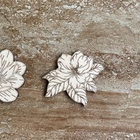 Handmade wooden DIY magnolia flower cutouts in two unique styles, ready for paint or decorating