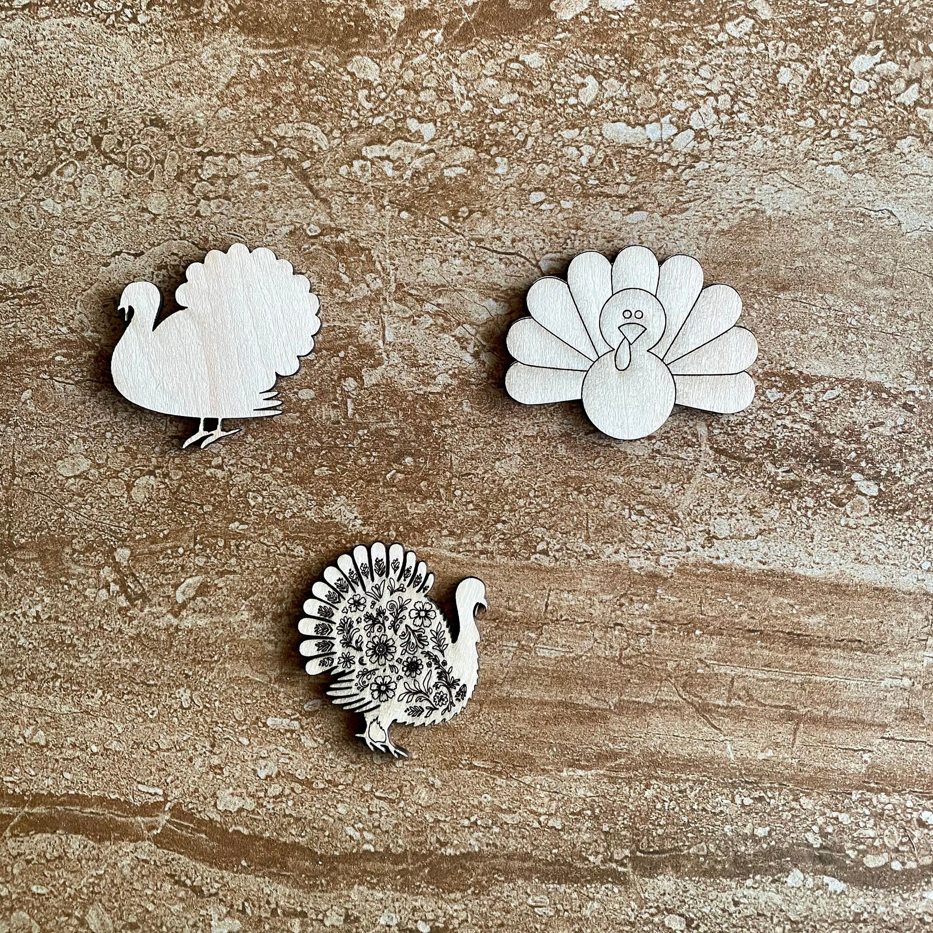 Handmade wooden DIY Thanksgiving turkey cutout in three unique styles, ready for paint or decorating