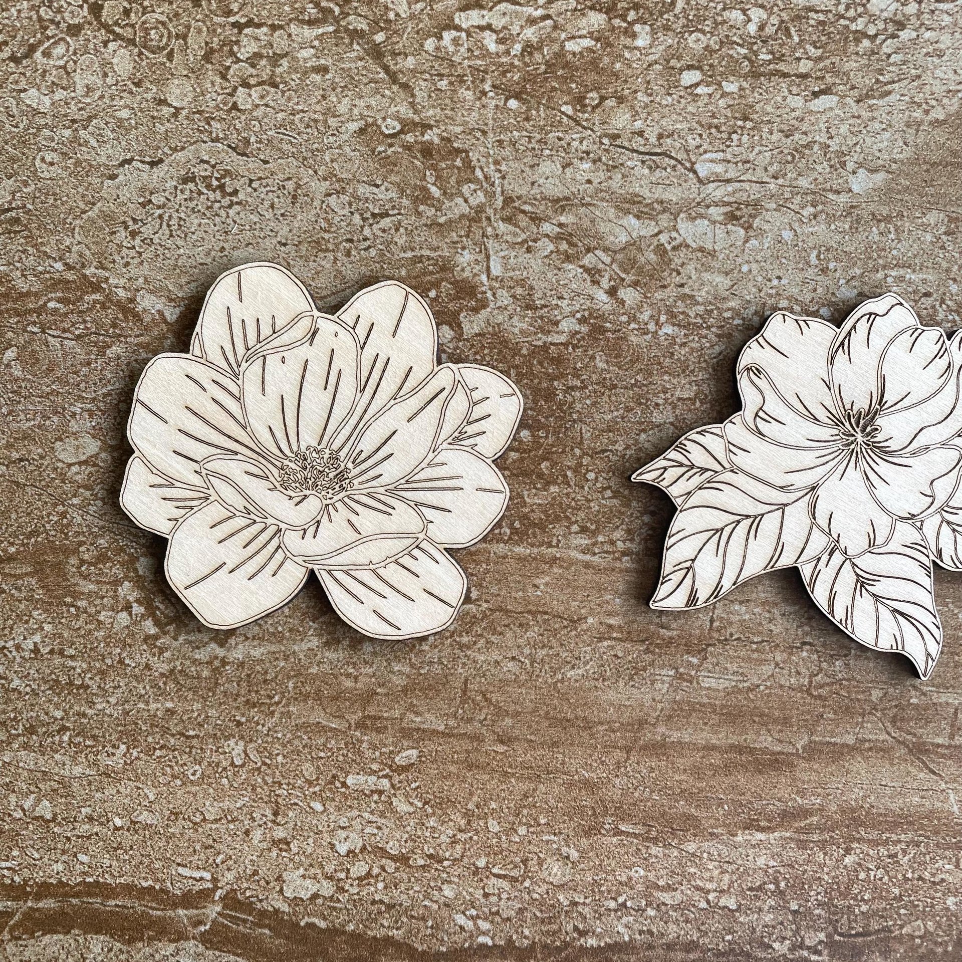 Handmade wooden DIY magnolia flower cutouts in two unique styles, ready for paint or decorating