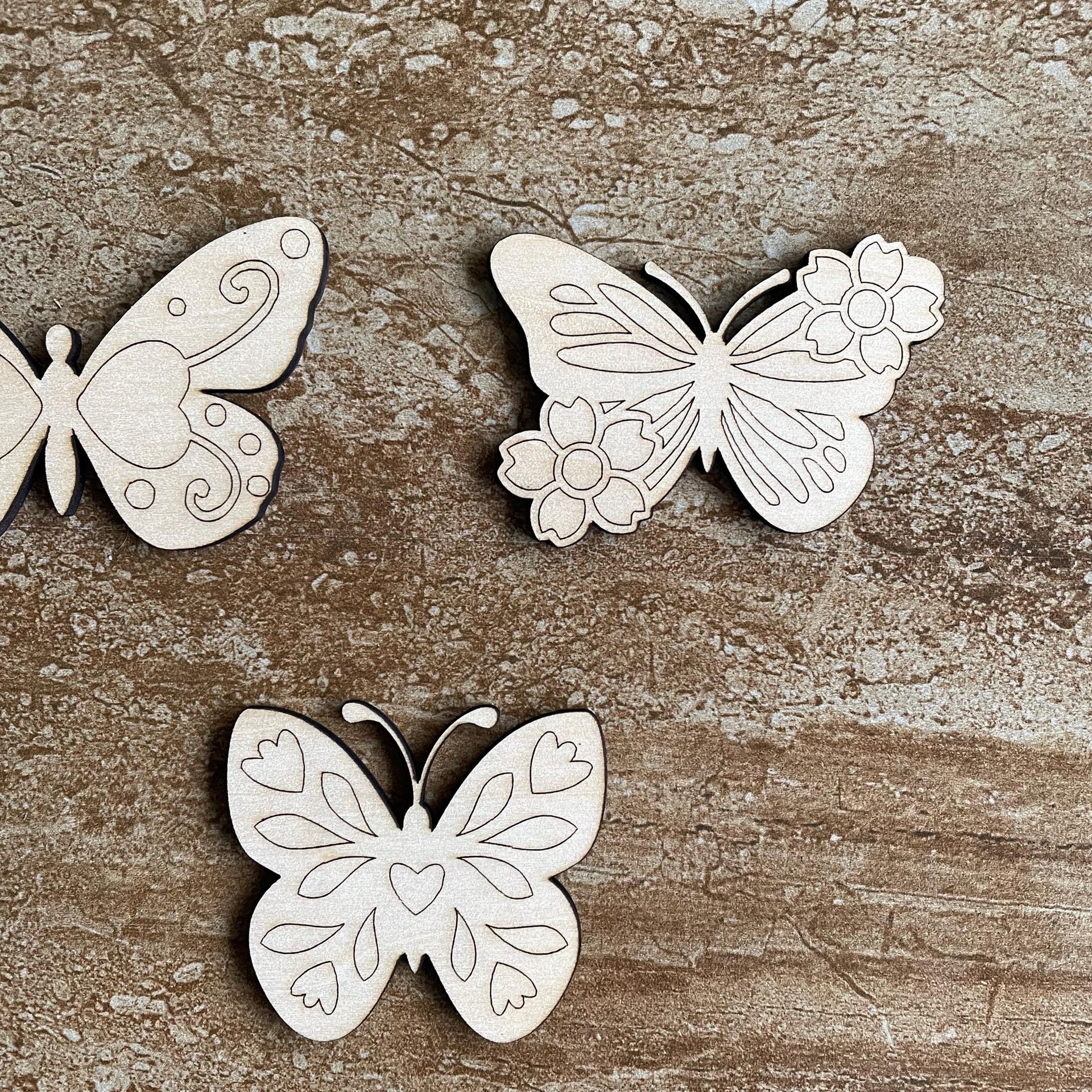 Handmade wooden DIY butterfly cutout in three unique styles, ready to paint or decorate