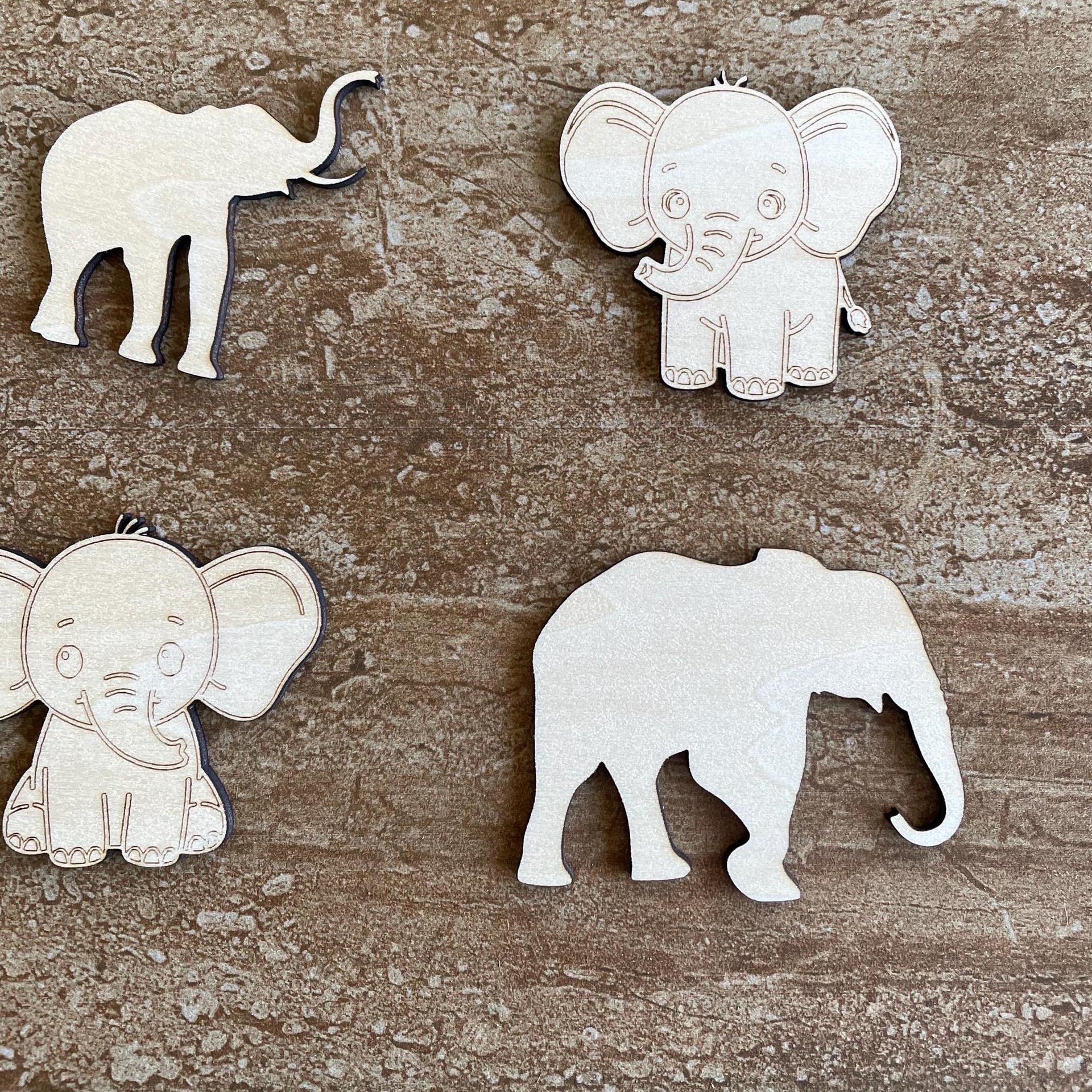 Handmade wooden DIY elephant cutout in four unique styles, ready to paint or decorate