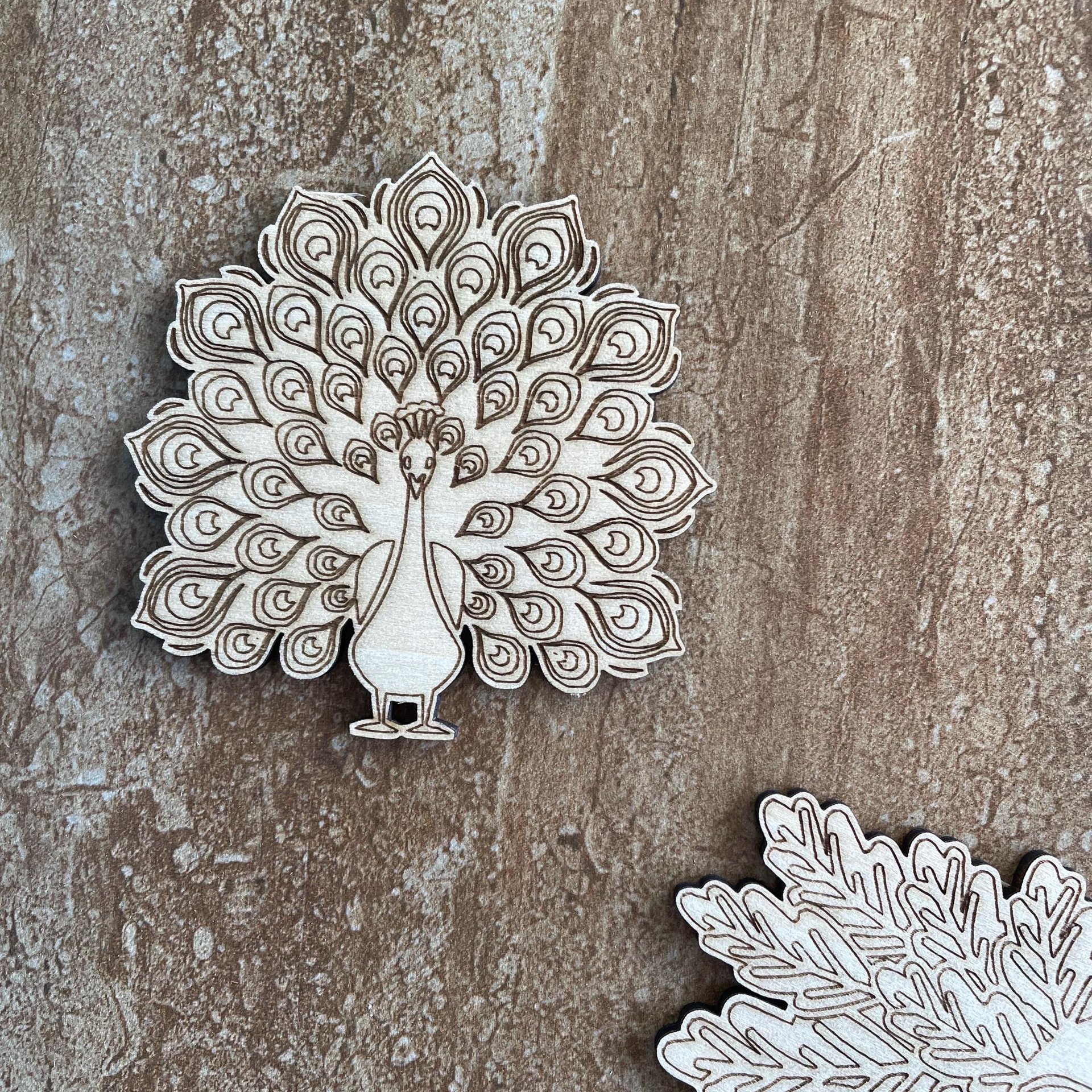 Handmade wooden DIY peacock cutout in two unique styles, ready to paint or decorate